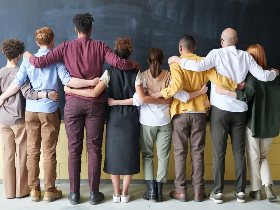 Group of people hugging.